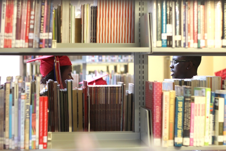 Nikos Frazier | The Youngstown Vindicator LaRazia Tolbert(left) talks with Marckese Williams(right) in the school library before the 2016 Chaney Campus High School Commencement on Friday, May 27, 2016.