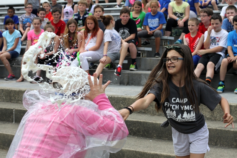 Nikos Frazier | The  Vindicator Jordyn Abyad(right) pies her fifth grade teacher, Lori Mowad(left), in the face after her name was drawn on Friday, June 3, 2016 at McKinley Elementary School in Poland.